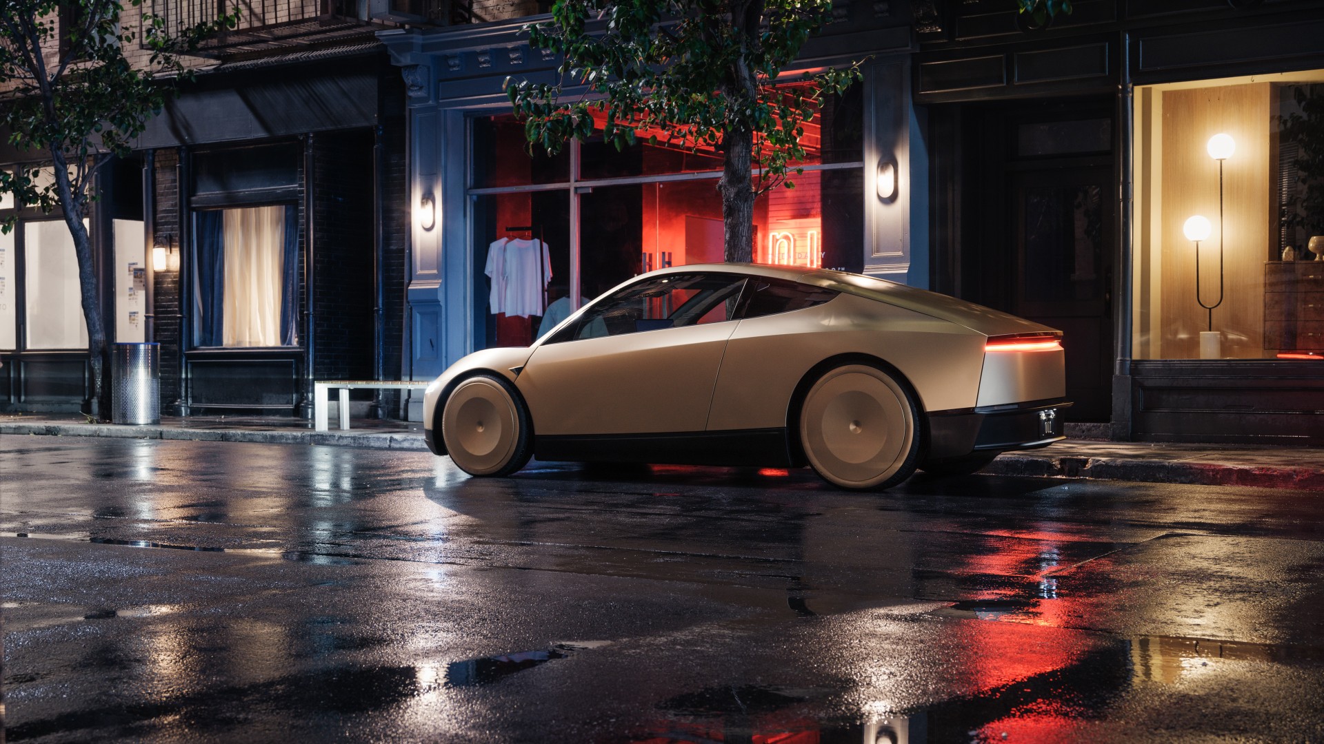 Un Tesla Cybercab dorado estacionado en una calle mojada de la ciudad por la noche frente a escaparates luminosos.